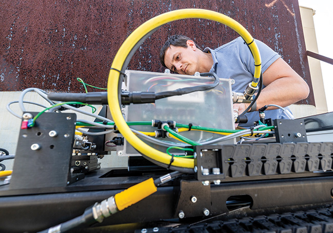 SwRI staff works with the SwRI-developed Guided Wave Robotic Inspection System