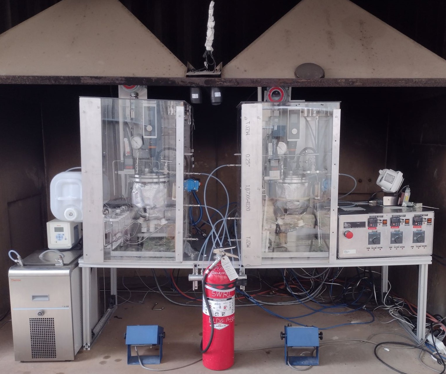 Figure 1: The two BELT rigs in a large hood with the Hydrogen BELT rig on the left and the ammonia BELT rig on the right.
