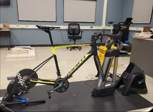 Stationary bike used for physical loading task.