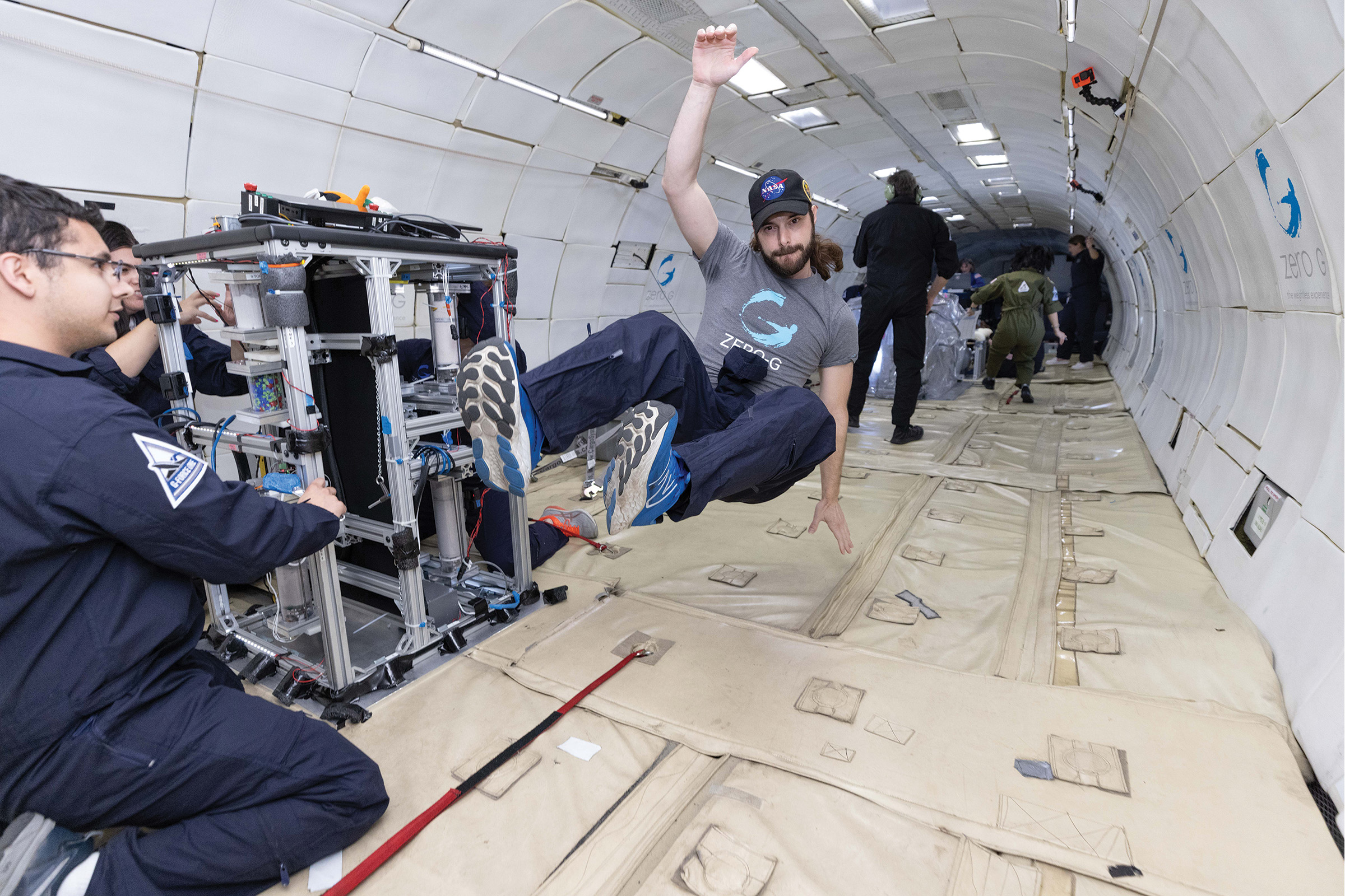 SwRI staff exhibiting the reduction of gravity conditions in parabolic flight