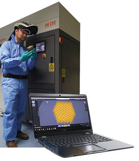 Technician in blue lab suit in front of machinery holding an additive manufacturing product