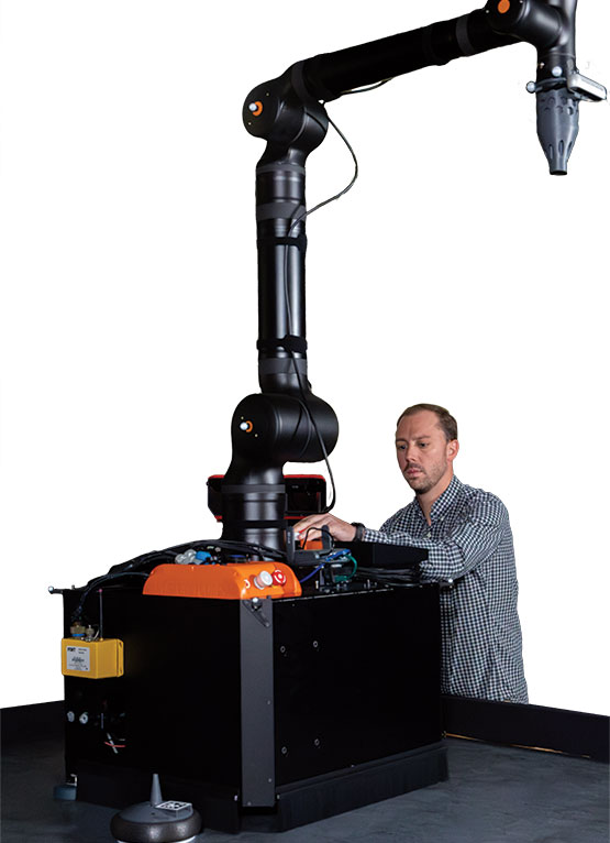 SwRI Senior Research Engineer Michael Ripperger validates MAST motion plans in the Space Robotics Center, using this 600-pound simulated robot that glides over the granite slab.