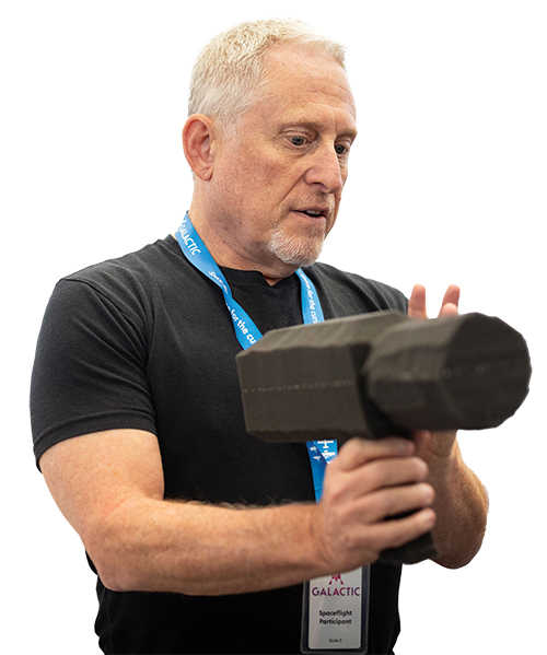 Dr. Alan Stern holding Ultraviolet Imaging System (SWUIS), an innovative, wide-field, visible and ultraviolet imager