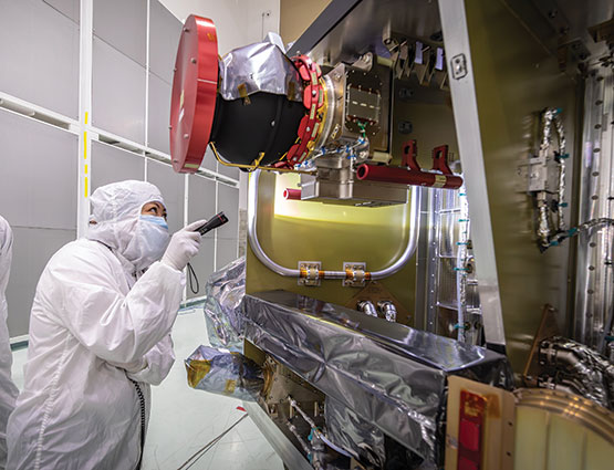 Anna Shin, deputy systems assurance manager from the Applied Physics Laboratory at Johns Hopkins University, performs a post-integration inspection of the SwRIdeveloped Compact Dual Ion Composition Experiment