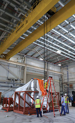 Large hangar with a ceiling hoist with STEP components underneath 