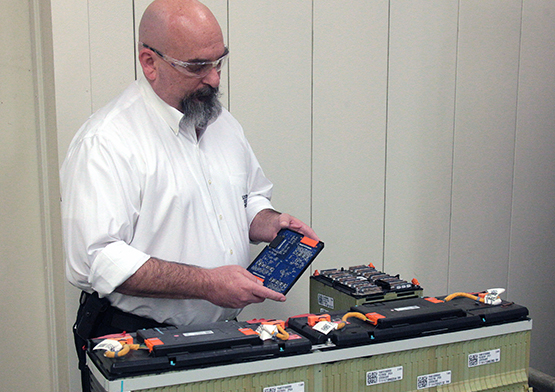 Mickey Argo testing automobile batteries