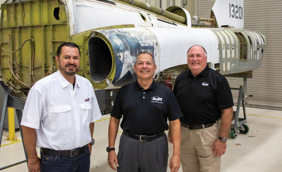 Edwin Aulick, Roger Lopez, and Tim Fey in a lab