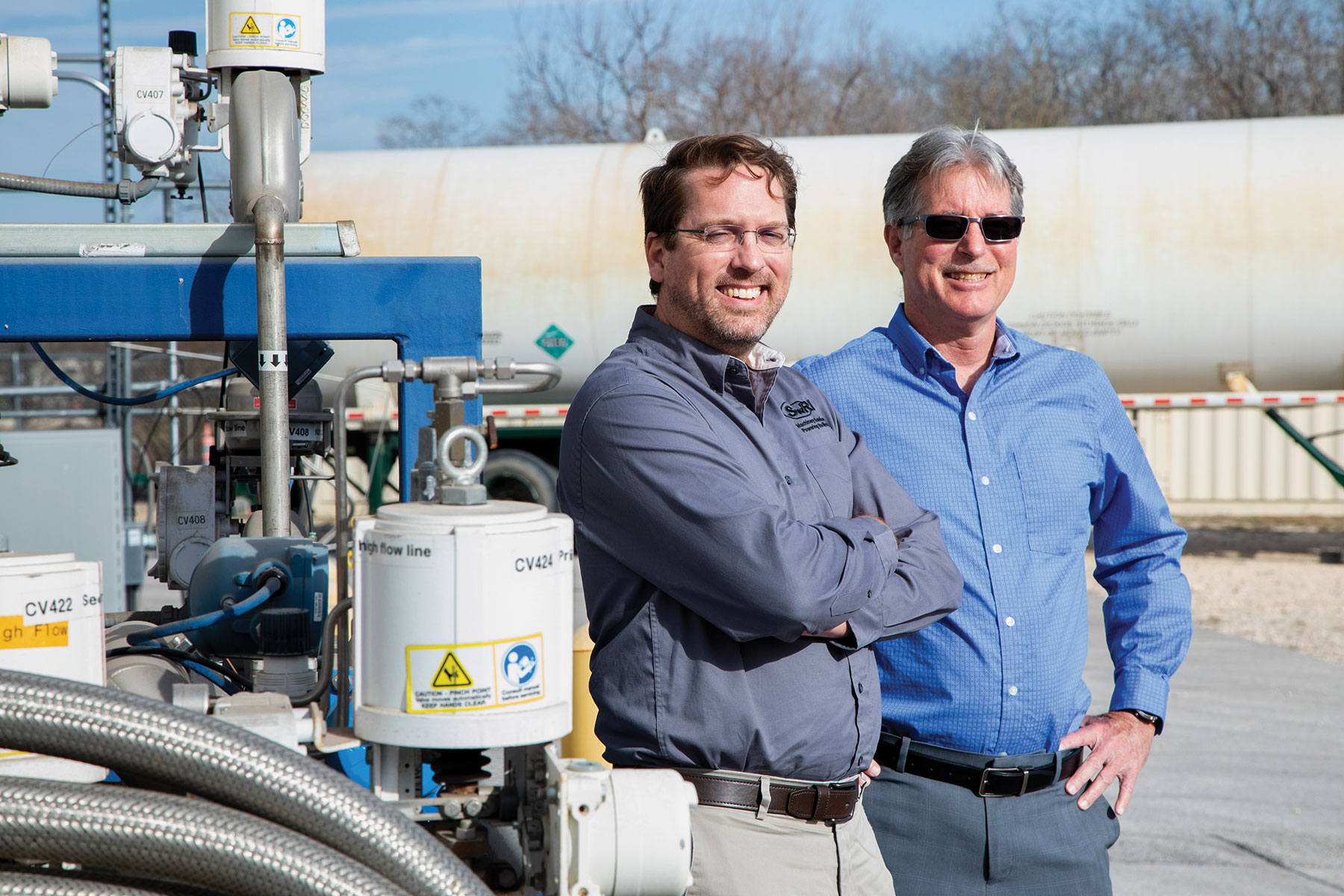 Portrait of Dr. Tim Allison and Tim Callahan in front of SwRI’s High-Energy Annex Test Facility