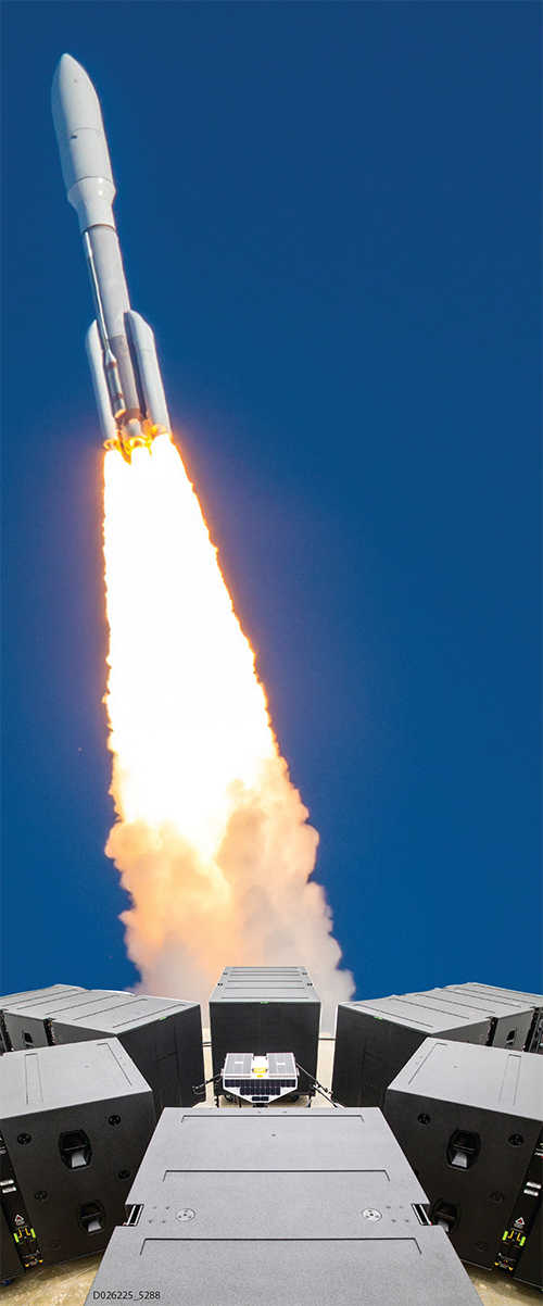 high-decibel acoustic test chamber with 6 speakers with rocket in background