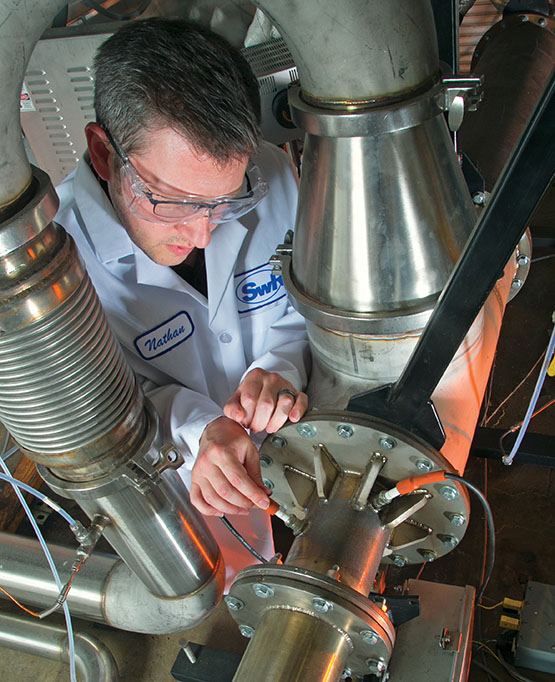 Technician inspecting the ECTO Lab combustor