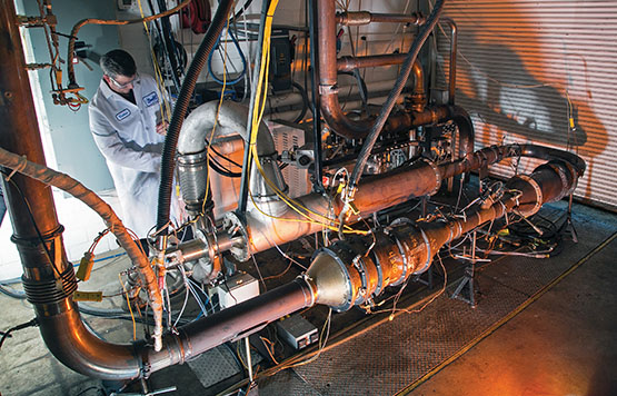 Staff member inspecting the ECTO Lab system