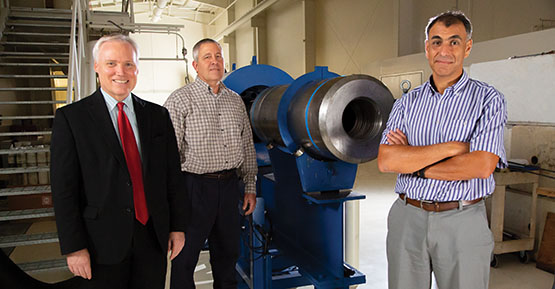 Team members standing around the light-gas gun