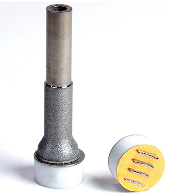 titanium tube affixed to a nickel-plated ceramic puck