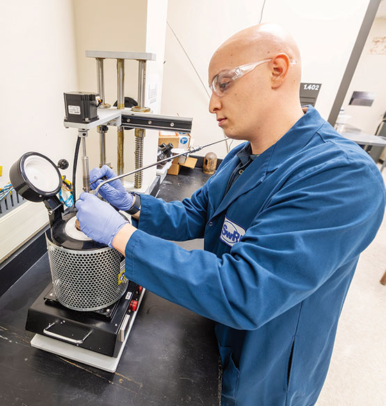  A scientist in a lab where researchers have produced gram quantities of graphene and other carbonaceous materials by bubbling carbon dioxide through a bed of liquefied alkali 