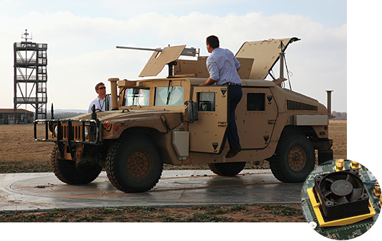 Humvee with miniature electronics inset