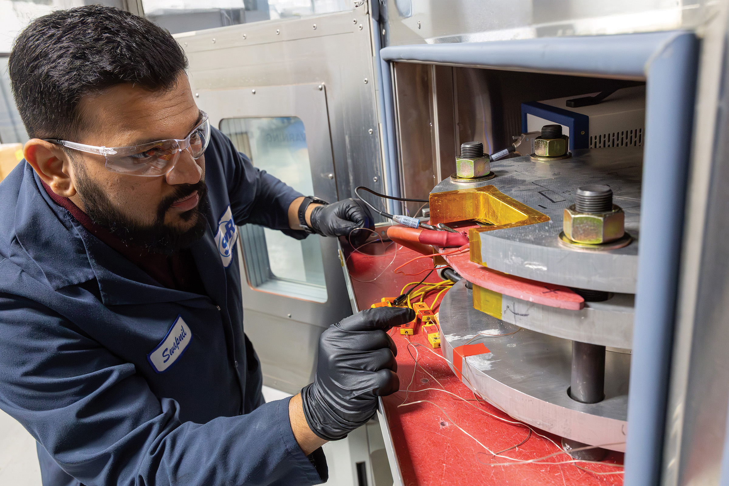 SwRI staff working on battery in SwRI lab