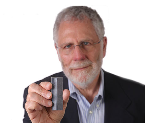 Dr. Jay Fisher holding a product created with additive manufacturing