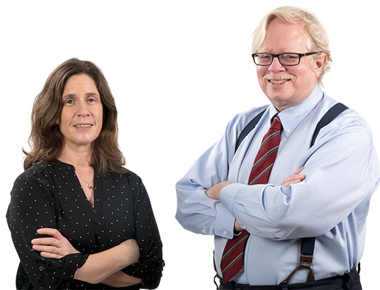 Dr. Kristin Favela in a black shirt and Dr. Keith Pickens in a blue shirt with red tie