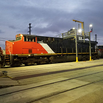 Red locomotive engine on a test track