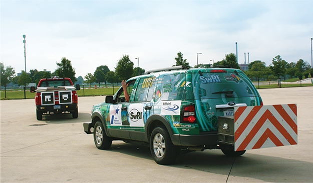 SwRI autonomous vehicle following behind lead vehicle with fiducial on tailgate