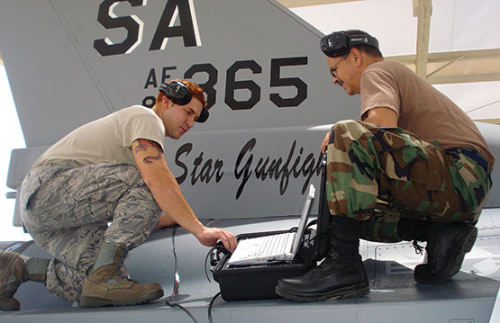 Two men using MsS on an aircraft