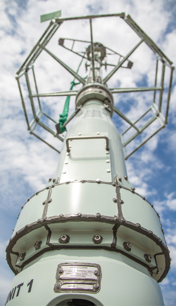 SwRI engineers designed the cylindrical slot array to fit near the base of this shipboard antenna to take advantage of existing unused space.