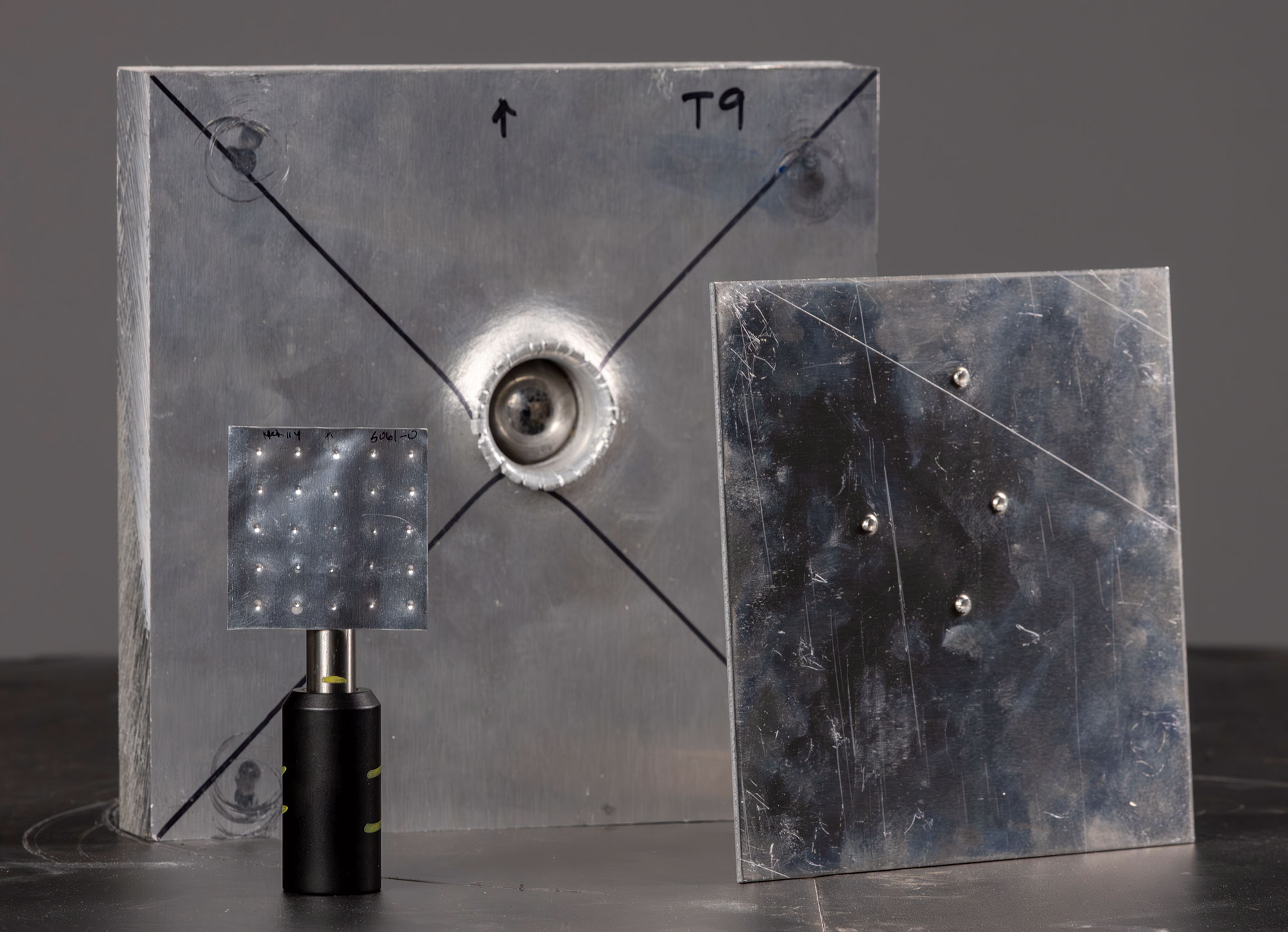 Comparison of SwRI compared LIPIT experiments (foreground) with conventional ballistics tests (background)