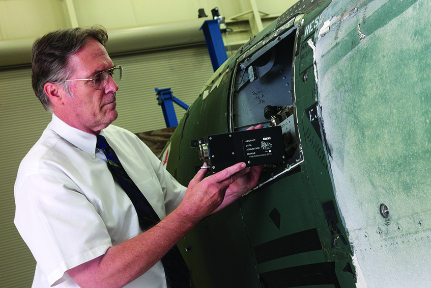 Recorder being mounted in aircraft.