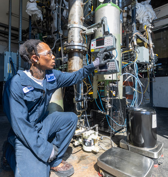 A technician working on fixed bed reactors systems.