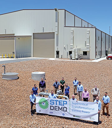 STEP building and team holding a banner saying STEP DEMO