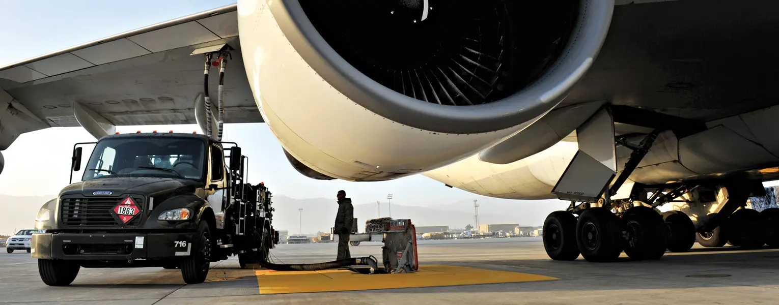 Tech. Sgt. Jeremy Whitworth watches the pressure gauge while refueling an aircraft with the new R-12 hydrant-servicing vehicle at Bagram Airfield, Afghanistan. 