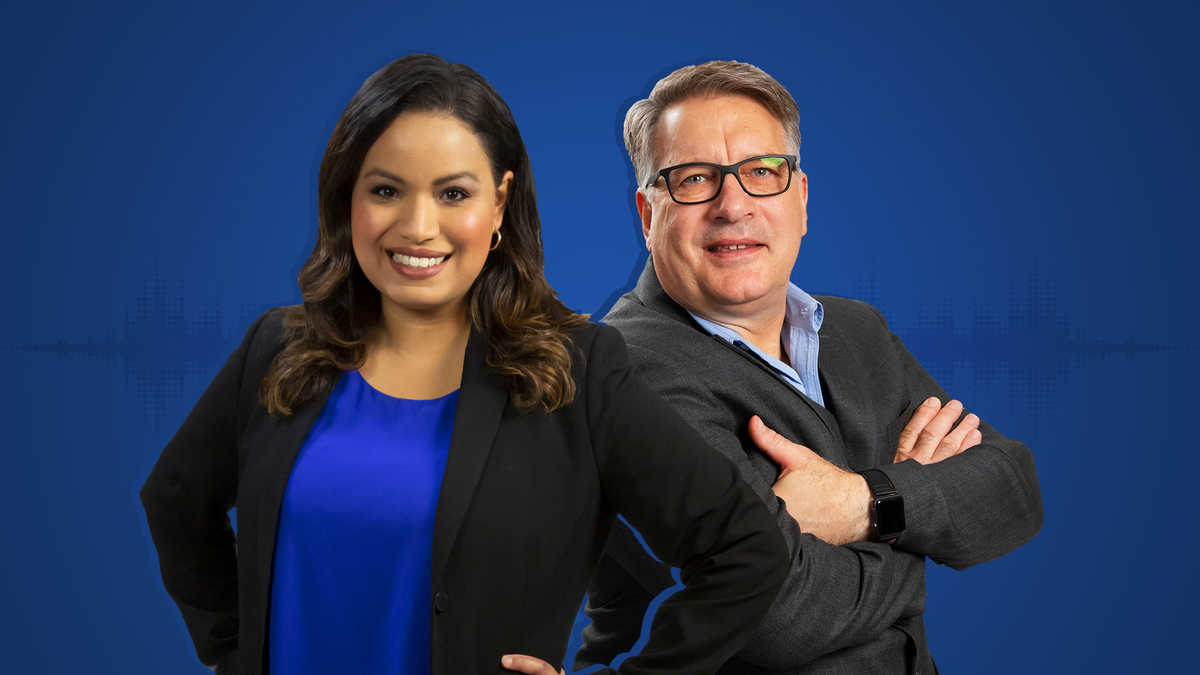 Lisa Peña and Dr. John Stamatakos against a solid blue background