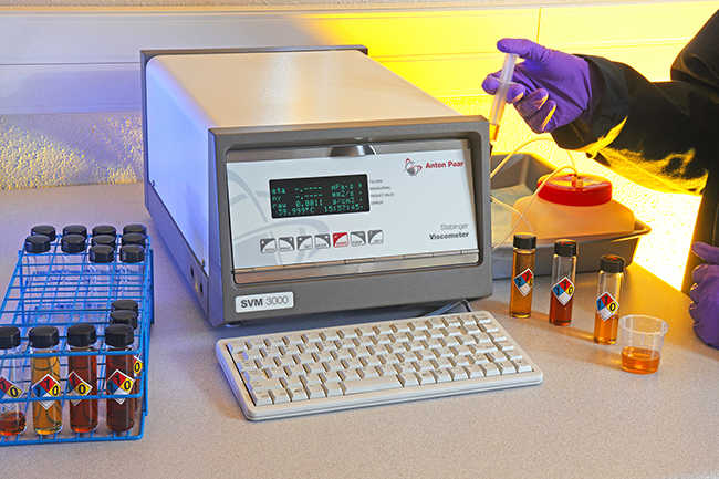 technician using Anton Paar SVM 3000 viscometer in a lab setting