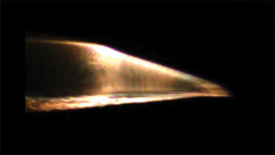 conical flight body launched from our two-stage light gas gun at Mach 14.8 or 11,400 mph