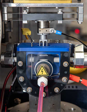 SwRI adapted this block-on-ring test system to supply electrical current across the test parts to replicate electric vehicle drivelines.