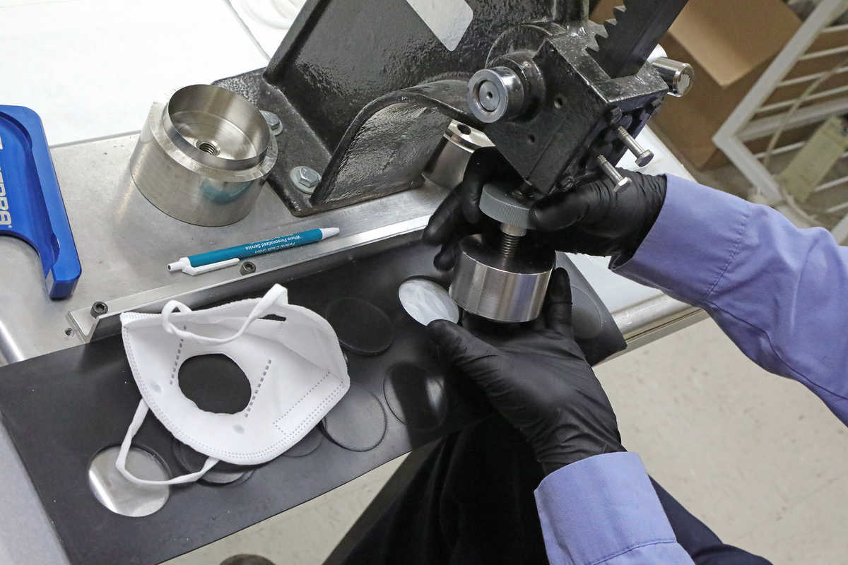 A face mask being tested in a lab under a scope