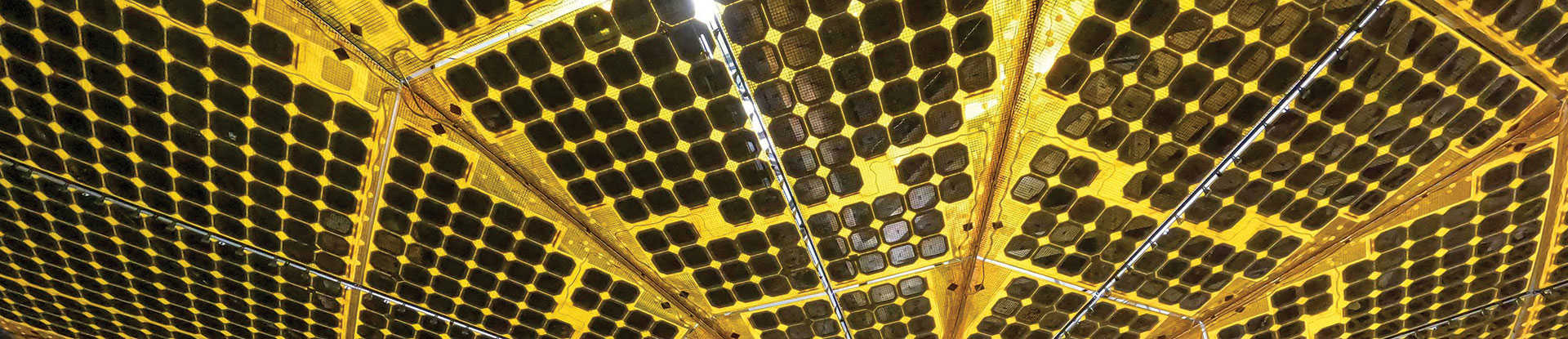 The underside of one of Lucy spacecraft's massive solar arrays in a thermal vacuum chamber