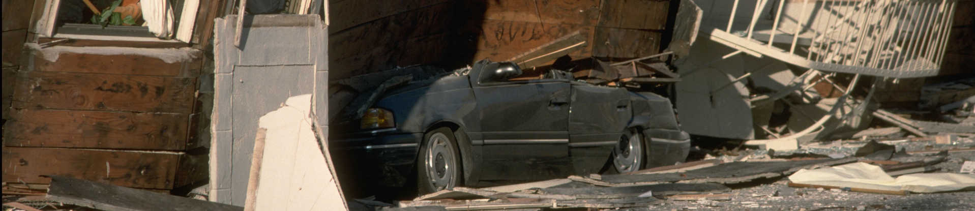 Automobile crushed under building after 1989 Loma Prieta earthquake in California