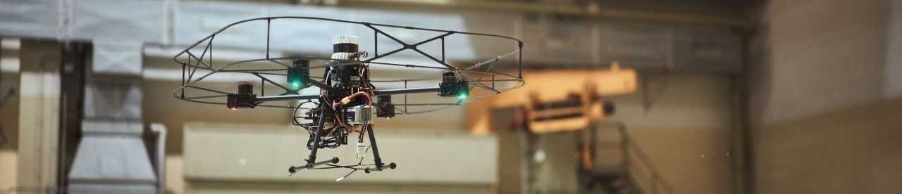 drone hovering over ventilation shaft