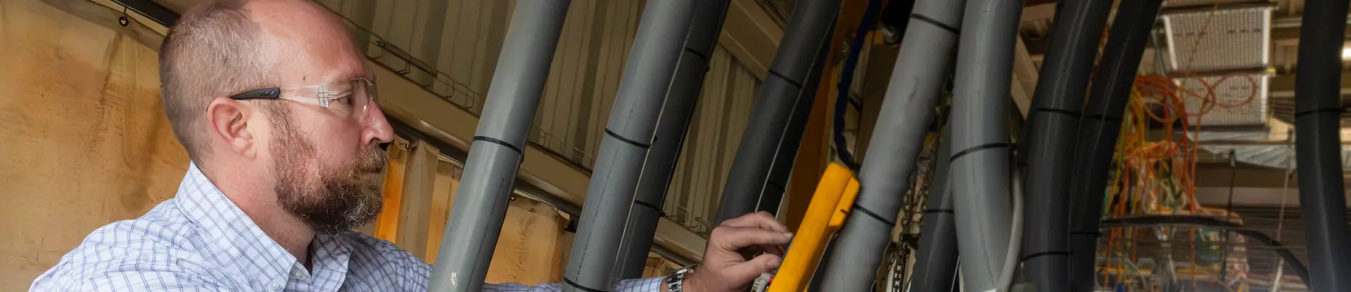 Engineer working in the High Energy Annex Test (HEAT) facility at SwRI
