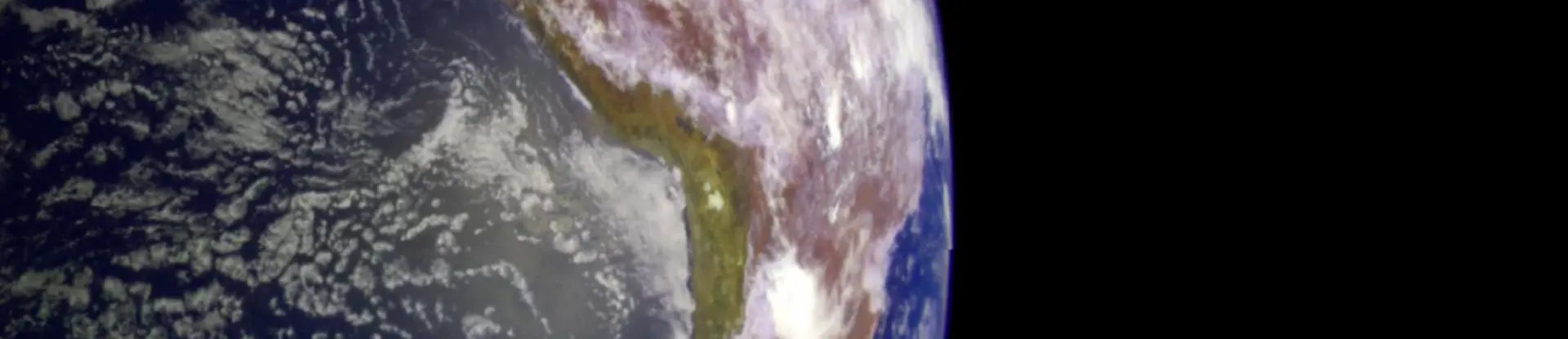 Planet Earth and moon against an empty black sky