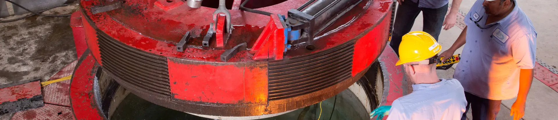 SwRI technicians lowering a specialized cover over a chamber in the ocean simulation lab
