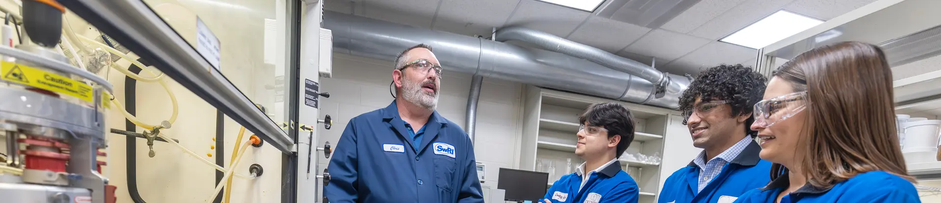 Trinity University and SwRI grant project team in a lab