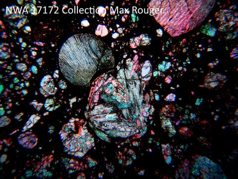Close up of chondrules in a polarized light micrograph