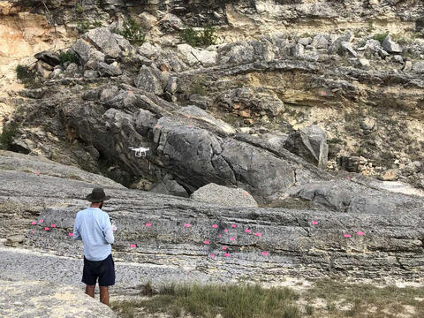 Dr. Adam Cawood, a senior research scientist in SwRI’s Earth Science Section, uses a drone to facilitate geological mapping.