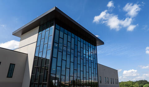 Exterior of the new CAMP building on a clear sunny day