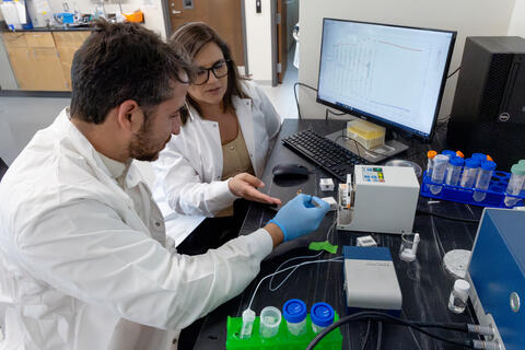 Carlos M. Cantu and Dr. Gabriela Romero Uribe using a smart sensors to automate processes to reduce human errors and costs associated with CAR T-cell production