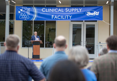 Adam Hamilton speaking at the Clinical Supply Facility ribbon cutting ceremony on March 23, 2026