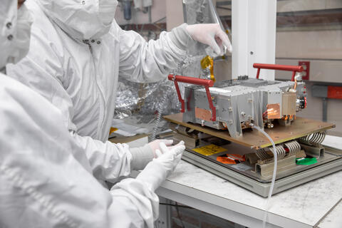 Two researchers during Europa-UVS clean cabin testing