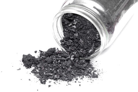 jar of biochar created using unique pyrolysis processing techniques